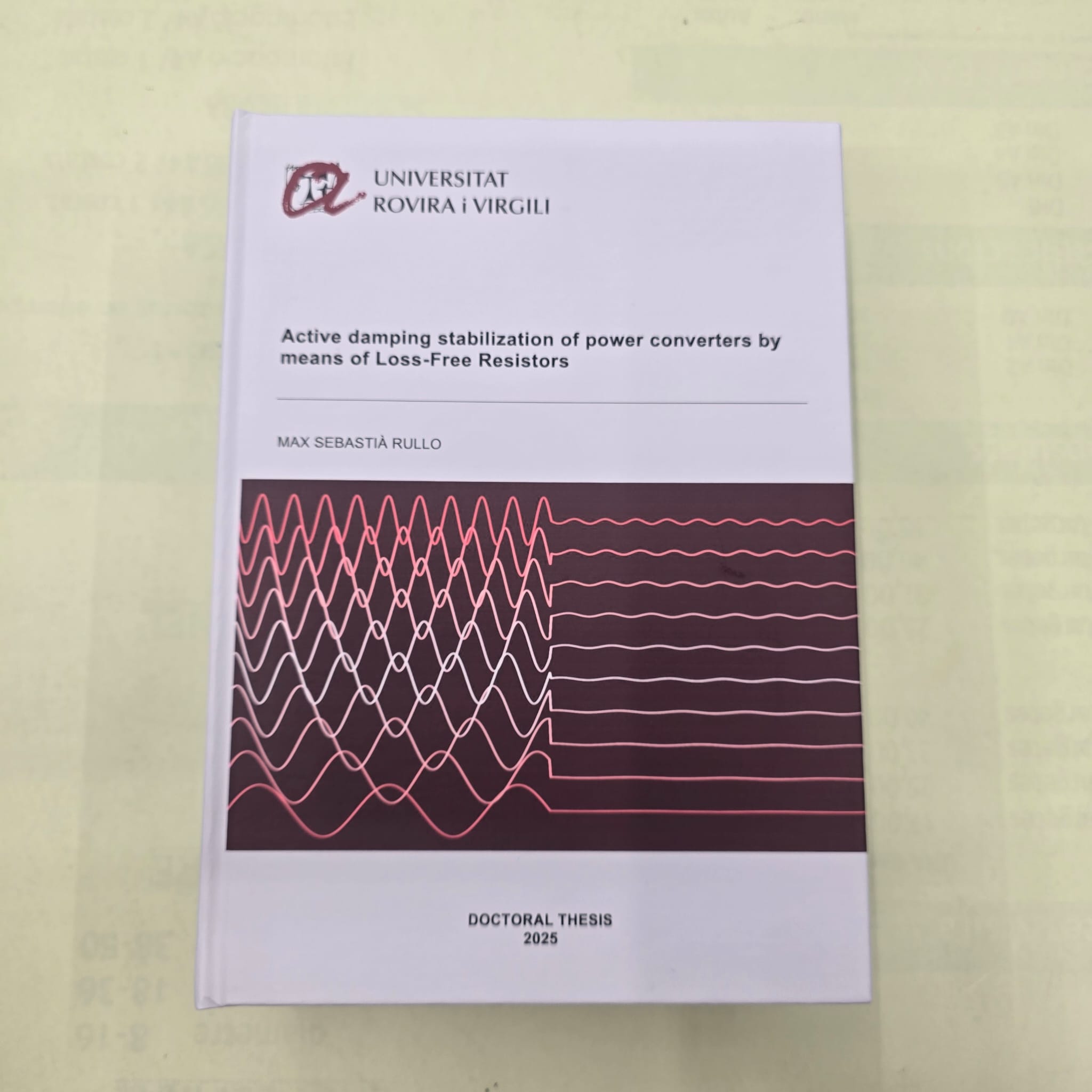 Tesis doctoral encuadernada con diseño de ondas
